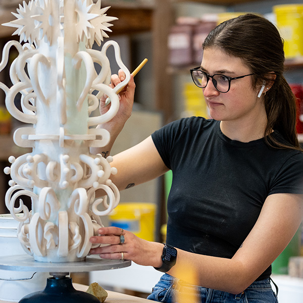 UL Lafayette art student working on a sculpture.